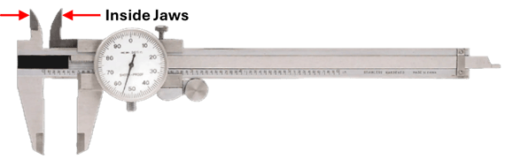 Dial caliper inside jaws measuring the internal width of a slot or opening