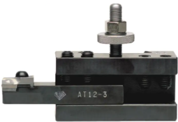 (Single Holder with Tool Bit) – Tool holder securely gripping a cutting tool for precision turning.