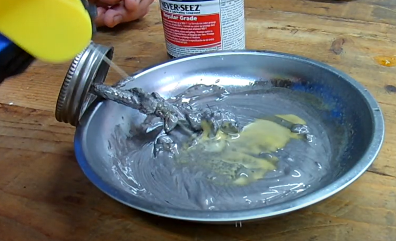 Metal bowl with homemade tapping oil mixture of anti-seize and penetrating oil.