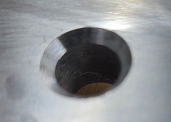 Metal workpieces with clean chamfered edges using pneumatic tool.