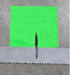 Align the first piece of tape on the floor with the mark on the blade