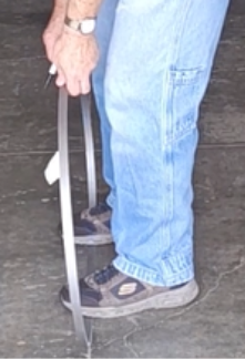 Roll the blade for one complete revolution. (Stepping on the blade as you walk helps to keep it from slipping.