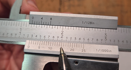 Finding the aligned vernier line on a vernier caliper