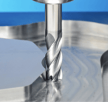 End mill cutting a metal workpiece during a milling operation
